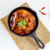 Indian,Spiced,Curried,Lamb,Meat,In,A,Iron,Skillet,With