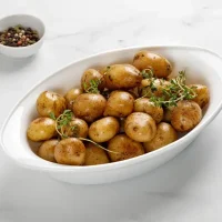 Roasted,Boiled,Young,Potatoes,In,White,Baked,Dish,With,Thyme.
